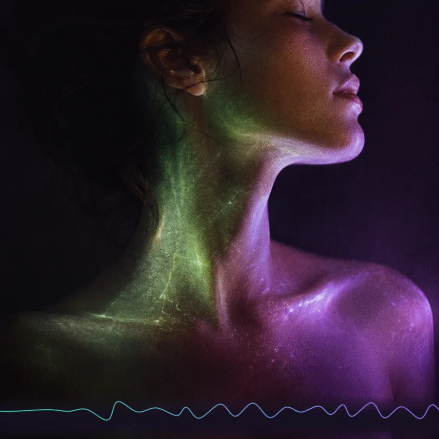 A face crossed by green and violet light — the signal made legible.