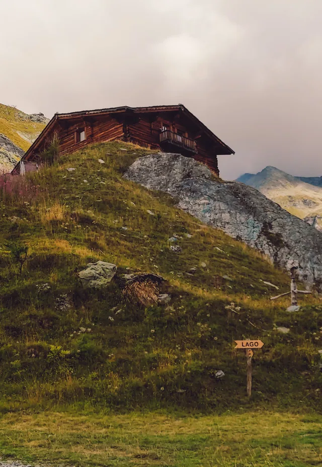 A timber refuge on the ridge at nightfall.